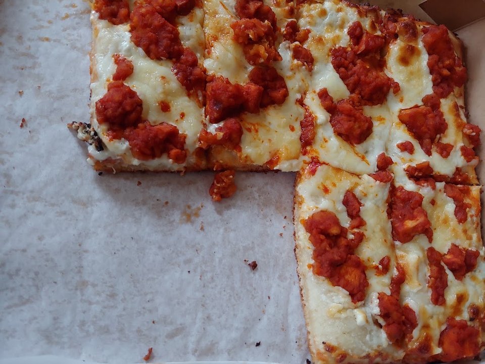 Pizza restaurant menu with specialty pies.