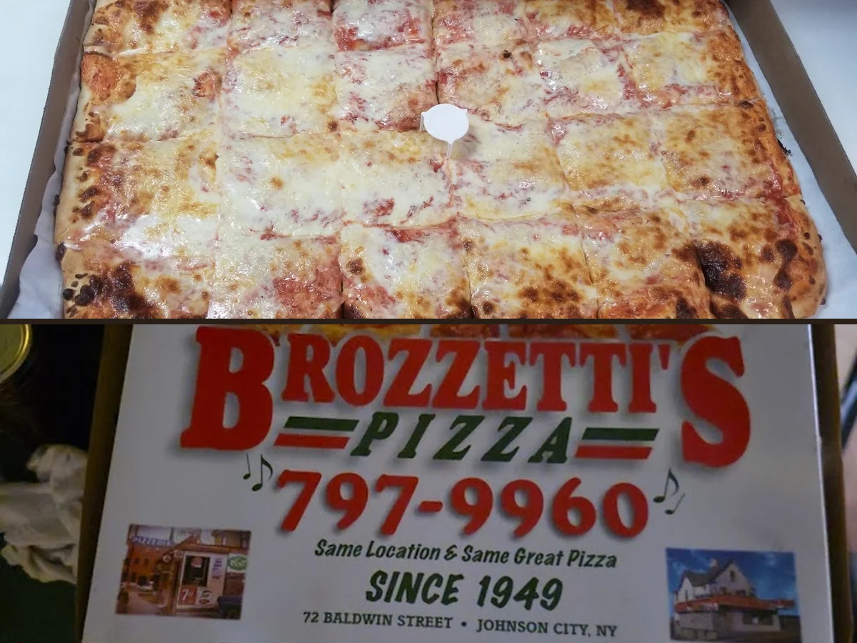 Sheet pizza cut into square pieces.